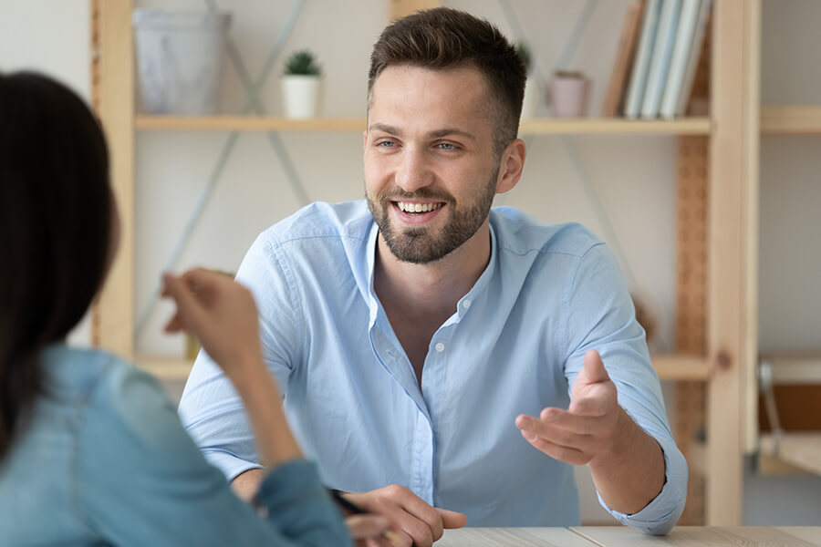 Man reaching out in meeting